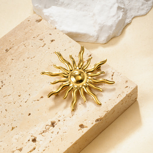 Broche doré soleil rayonnant bombé effet miroir