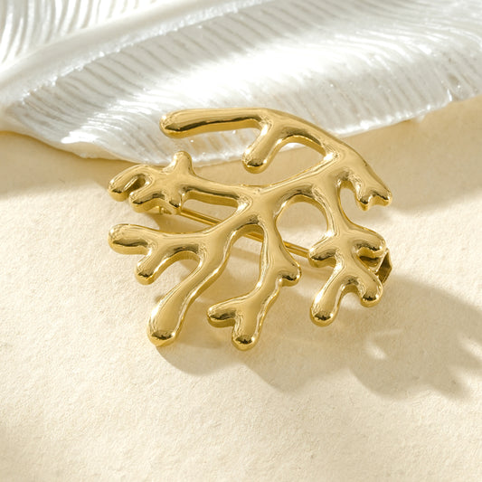 Broche dorée branche de corail sculpturale inspiration marine élégante