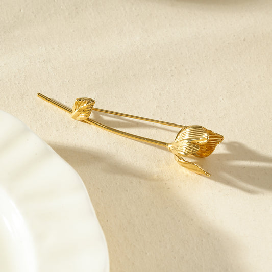Broche dorée en forme de tulipe texturée en relief
