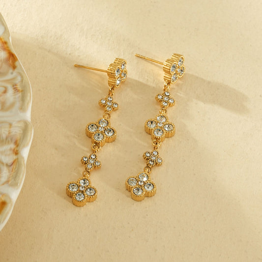 Boucles d’oreilles pendantes 5 fleurs strassées