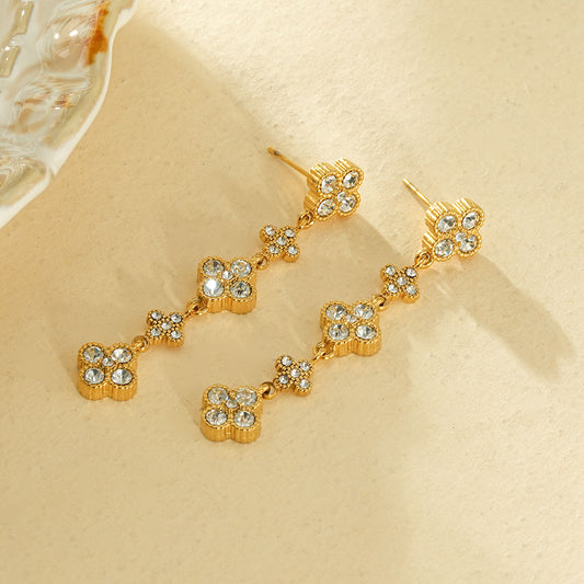 Boucles d’oreilles pendantes dorées 5 fleurs strassées