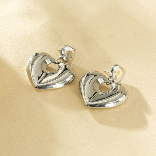 Boucles d’oreilles argentées cœurs bombés lisses pendantes