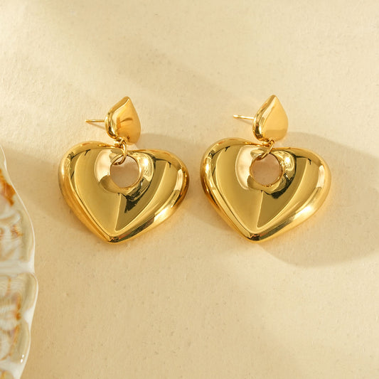 Boucles d’oreilles dorées cœurs bombés lisses pendantes