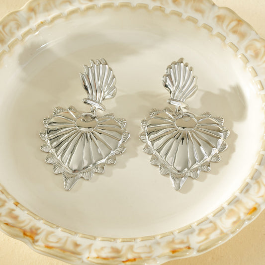 Boucles d'oreilles argentées pendantes grand cœur bombé texturé