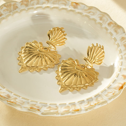 Boucles d'oreilles dorées pendantes grand cœur bombé texturé