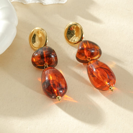 Boucles d'oreilles dorées pendantes double pierre ambré