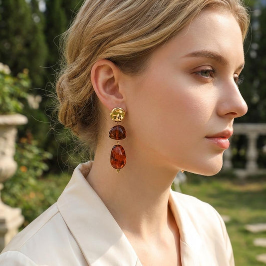Boucles d'oreilles dorées pendantes double pierre ambré