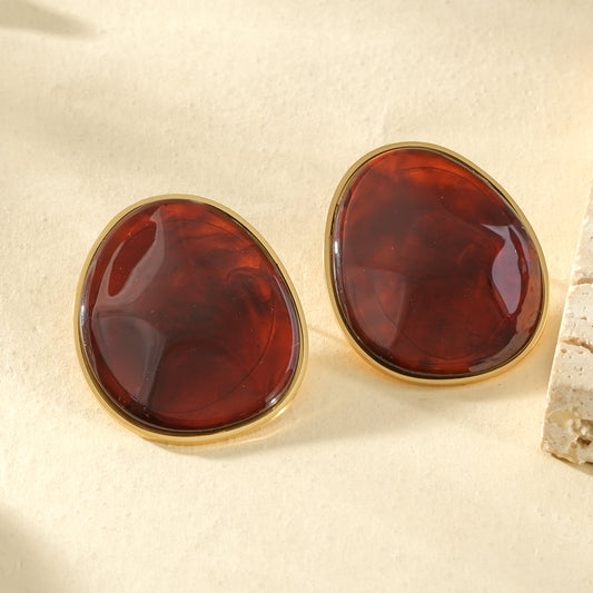 Boucles d'oreilles dorées pierre ovale ambré