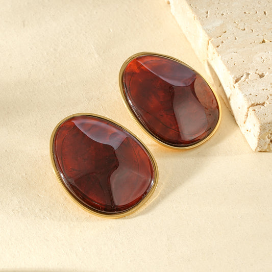 Boucles d'oreilles dorées cabochon ovale ambré