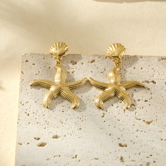 Boucles d'oreilles dorées coquillages et étoiles de mer