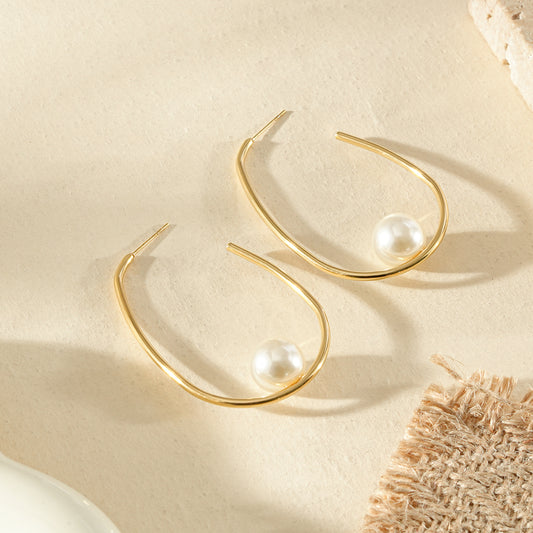 Boucles d'oreilles dorées créoles ouverte ovale avec perle