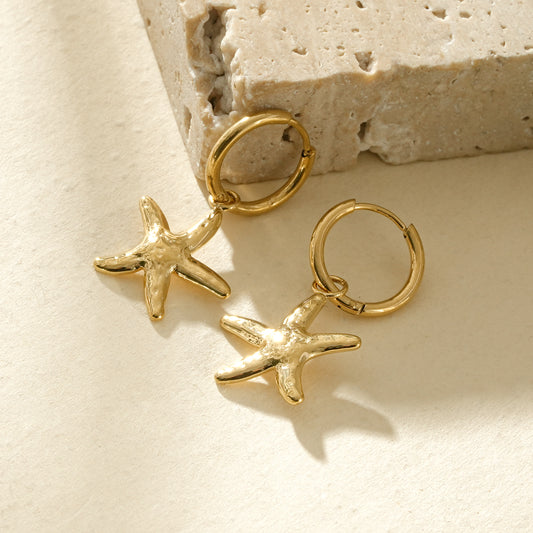 Boucles d'oreilles créoles dorées étoile de mer plate