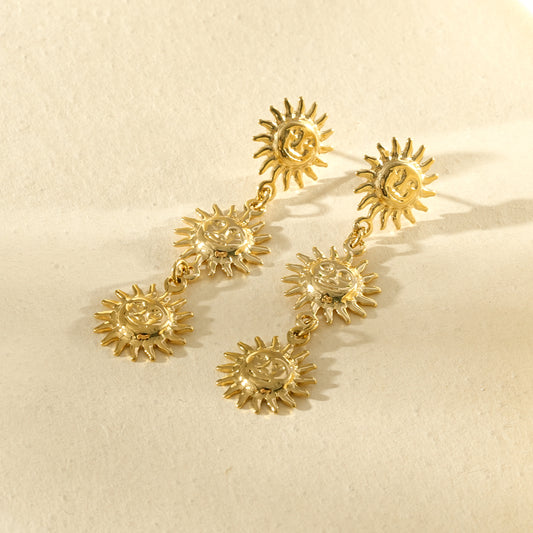 Boucles d'oreilles dorées à pendentifs triple soleils pendants
