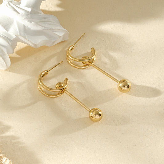 Boucles d’oreilles dorées créoles ouvertes avec tige pendante et boule