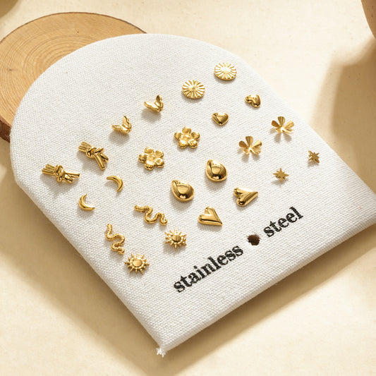 Lot de 12 paires de puces d'oreilles dorées motifs tendance sur présentoir