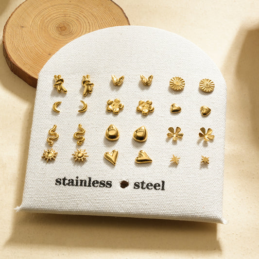 Lot de 12 paires de puces d'oreilles dorées motifs tendance sur présentoir