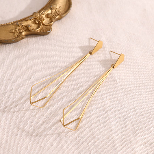 Boucles d'oreilles pendantes dorées effet cage