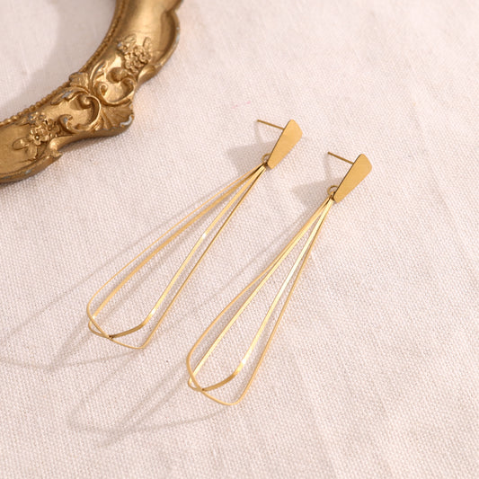 Boucles d'oreilles pendantes dorées effet cage allongée