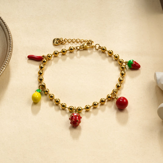 Bracelet boules dorées thème fruité