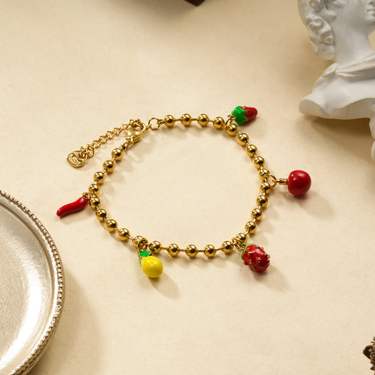 Bracelet boules dorées thème fruité
