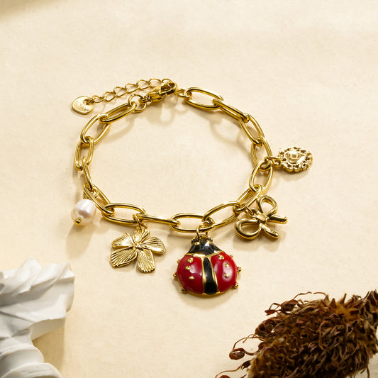 Bracelet chaîne dorée breloques coccinelle thème jardin