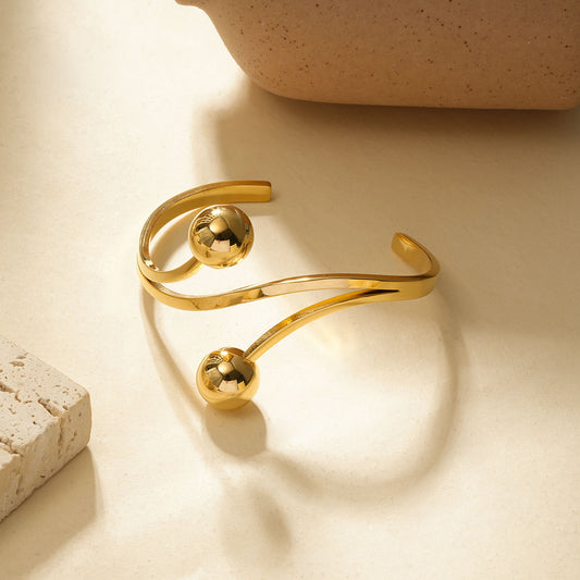 Bracelet jonc ouvert à double branche torsadée avec extrémités en boules lisses