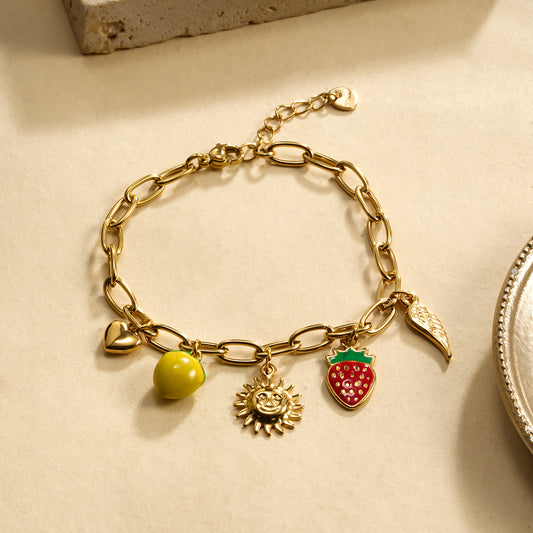 Bracelet dorée breloques citron fraise soleil