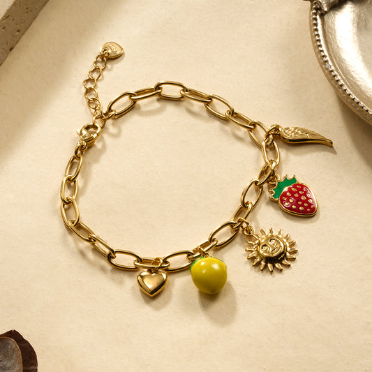 Bracelet dorée breloques citron fraise soleil