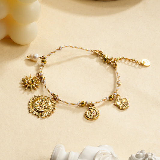 Bracelet cordon beige breloques soleil