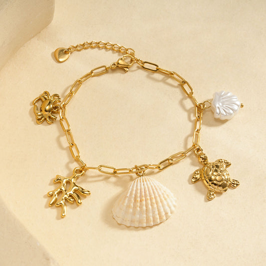 Bracelet chaîne dorée avec corail tortue et coquillage