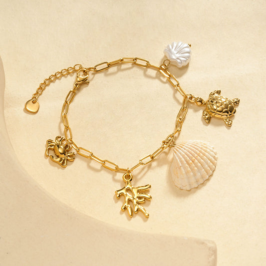 Bracelet chaîne dorée avec corail tortue et coquillage
