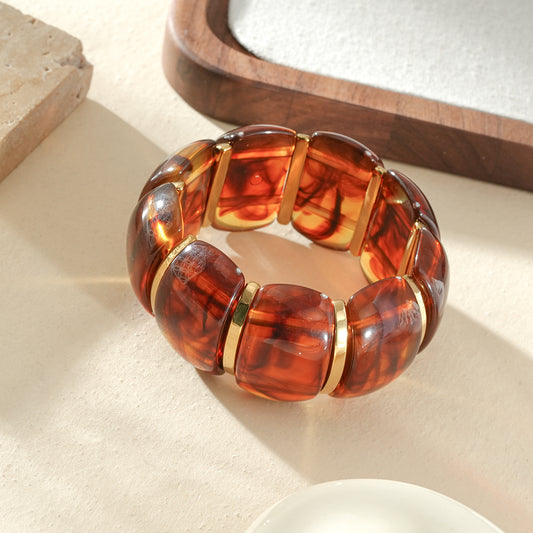 Bracelet élastique large bombé en résine ambré