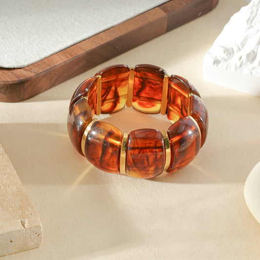 Bracelet élastique large bombé en résine ambré