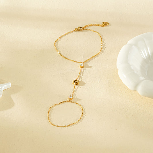 Bracelet chaîne de main dorée fleur 5 pétales et strass carré