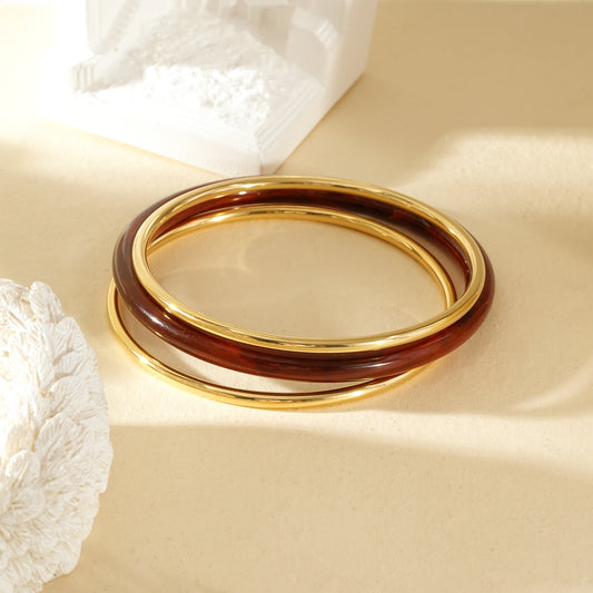 Lot de 3 bracelets jonc doré et résine ambré