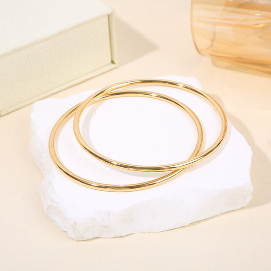 Lot de 2 bracelets joncs dorés fins