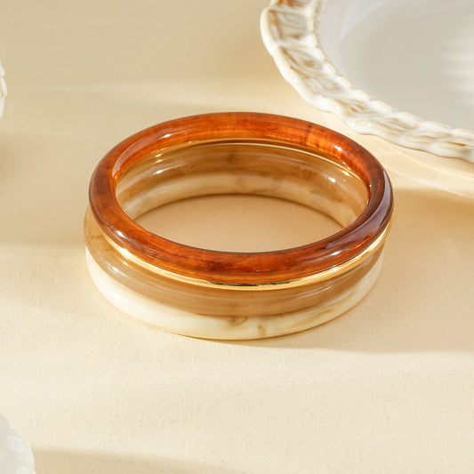 Lot de 4 bracelets joncs en résine couleur marbré, ambré et doré