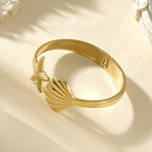 Bracelet jonc doré étoile de mer et coquillage