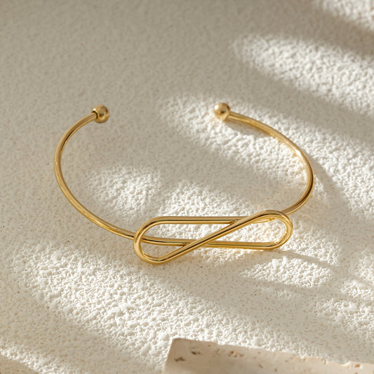 Bracelet Jonc Fin Ouvert Doré Nœud Infini