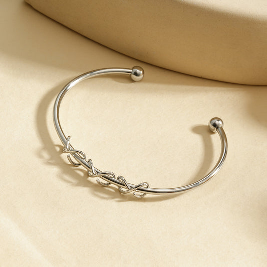 Bracelet manchette argentée ajustable motif nœuds entrelacés