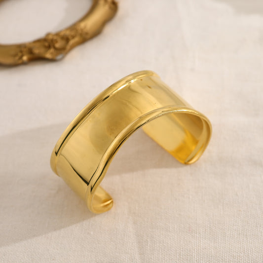 Bracelet manchette doré effet miroir avec extrémités bombées