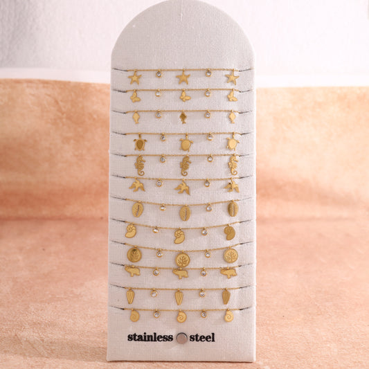 Lot de 12 bracelets dorés thème océan sur présentoir