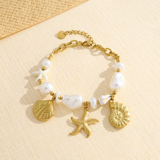 Bracelet doré perles et breloques marines