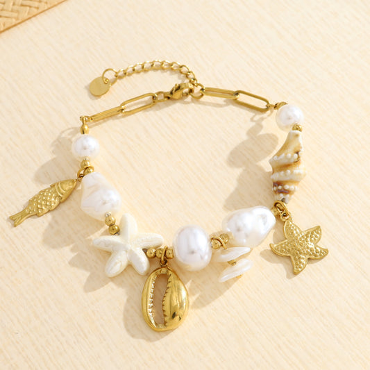 Bracelet doré perles et coquillage, étoile de mer et poisson
