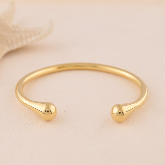 Bracelet jonc fin doré ouverture avant extrémités bombées