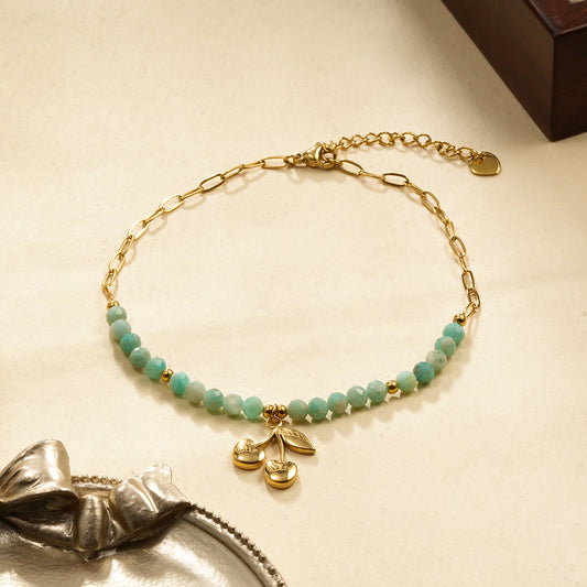 Chaîne de cheville pierres bleues et cerise dorée