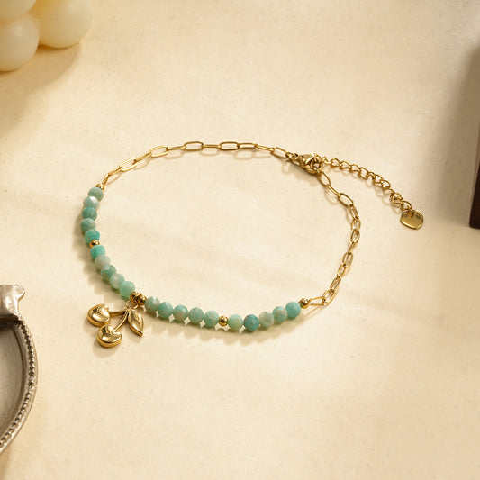 Chaîne de cheville pierres bleues et cerise dorée