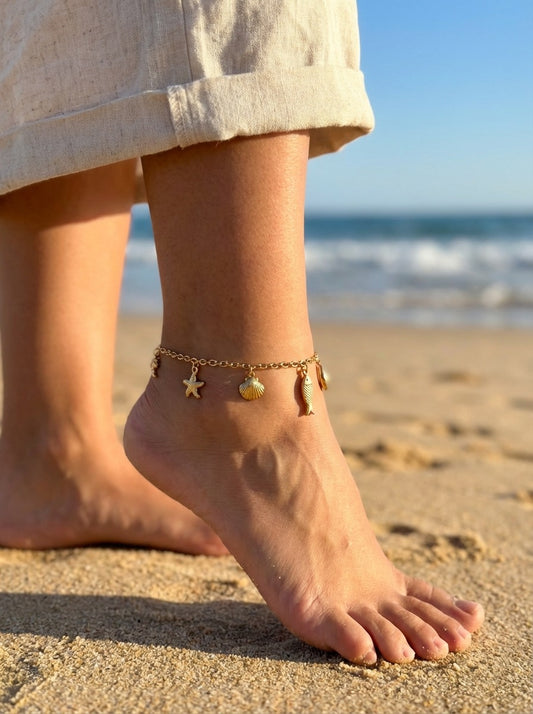 Chaîne de cheville dorée poisson et coquillage