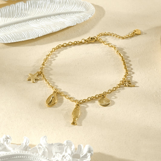Chaîne de cheville dorée poisson et coquillage