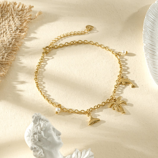 Chaîne de cheville dorée palmier et dauphin